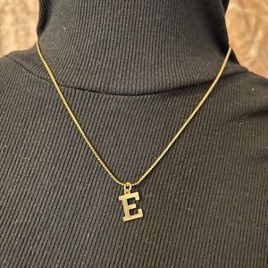 Brand name manon , says manon on necklace